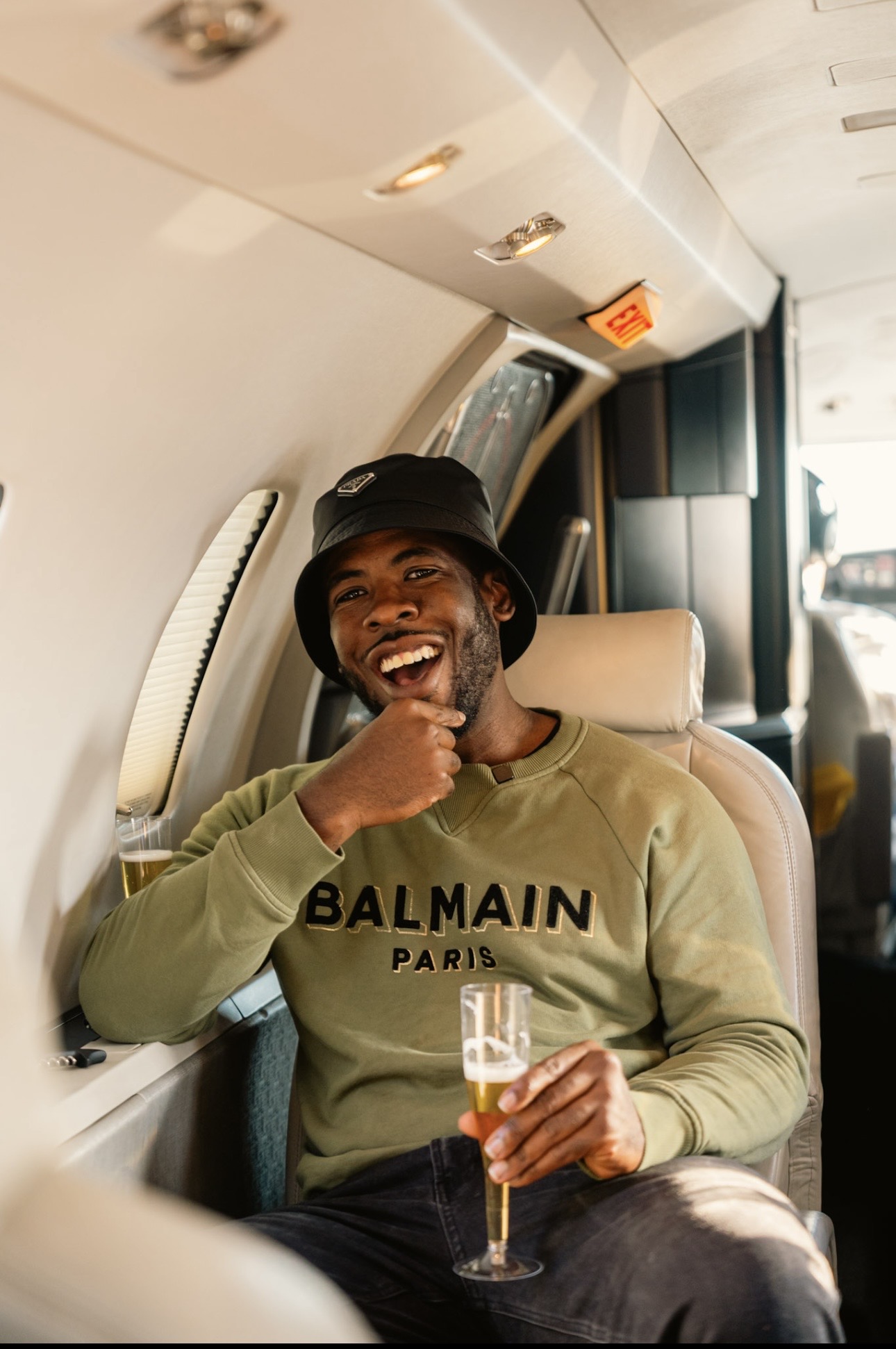 Kel celebrating aboard a private jet